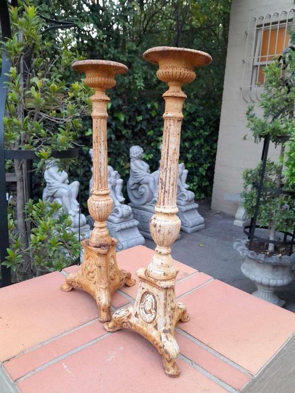 A 20th Century French Pair Of Cast Iron Candle Sticks