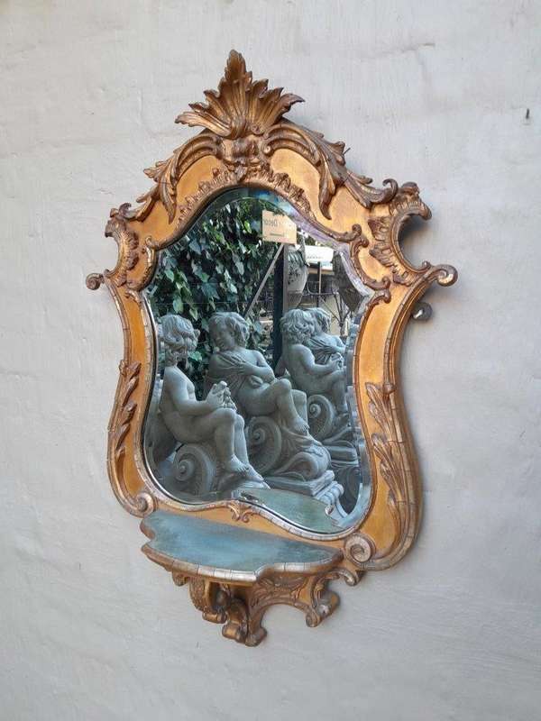 A 19th Century Giltwood And Bevelled Mirror With Shelf