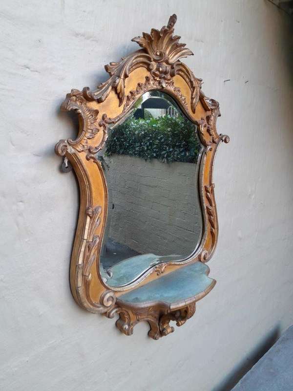 A 19th Century Giltwood And Bevelled Mirror With Shelf