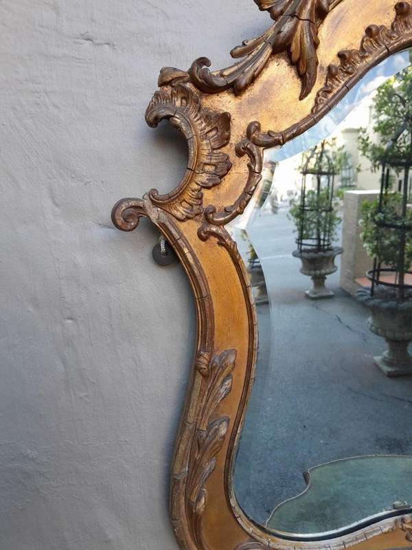 A 19th Century Giltwood And Bevelled Mirror With Shelf
