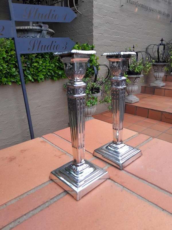A Pair Of Electroplate Candlesticks