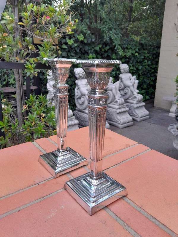 A Pair Of Electroplate Candlesticks