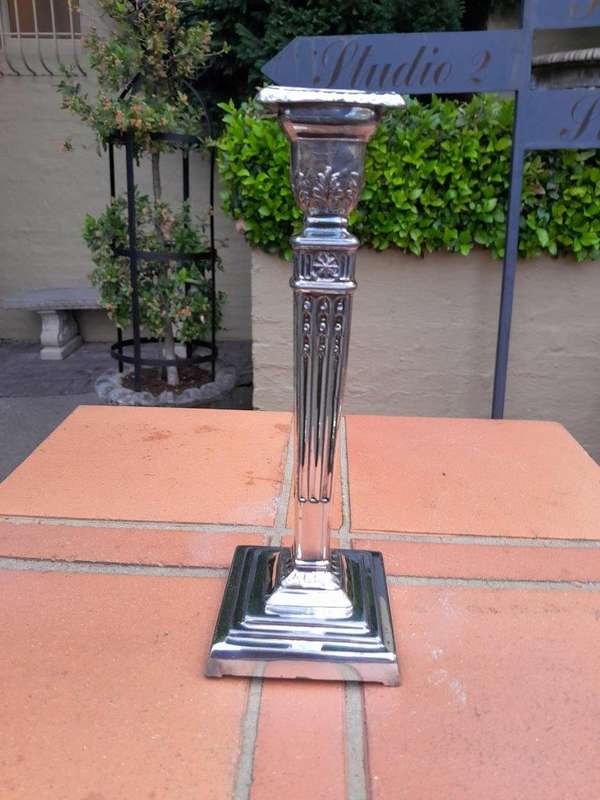 A Pair Of Electroplate Candlesticks