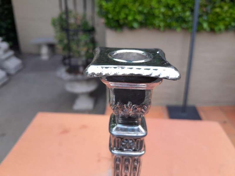 A Pair Of Electroplate Candlesticks
