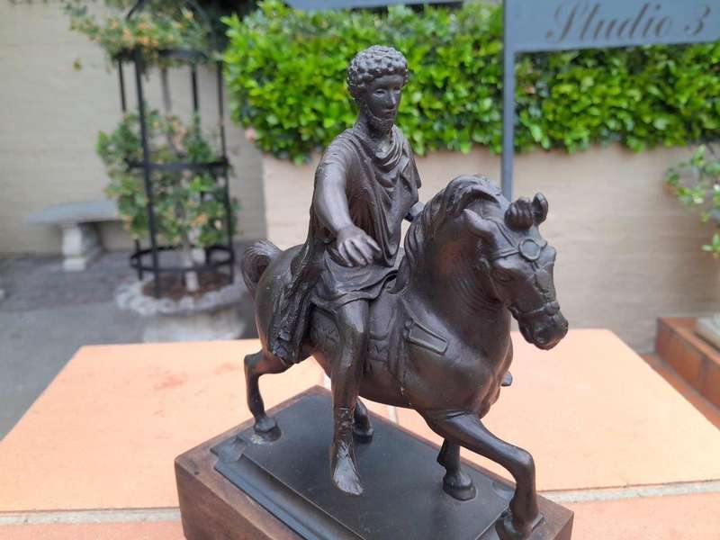 A Bronze Male Figurine On Horseback On Wooden Base In A Glass Cloche