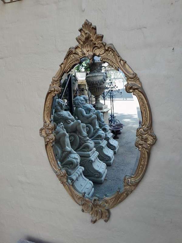 A French Style Ornately Carved Gilt Wood Bevelled Mirror