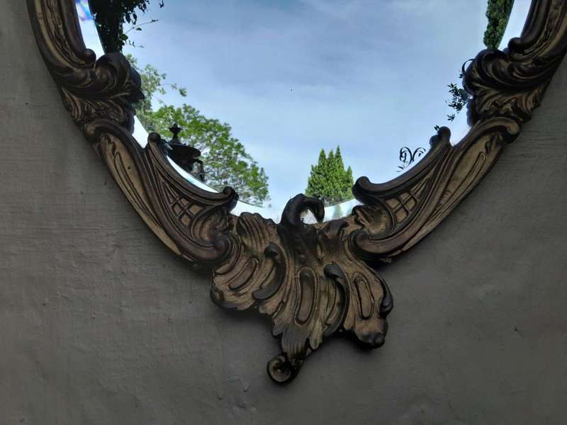 A French Style Ornately Carved Gilt Wood Bevelled Mirror
