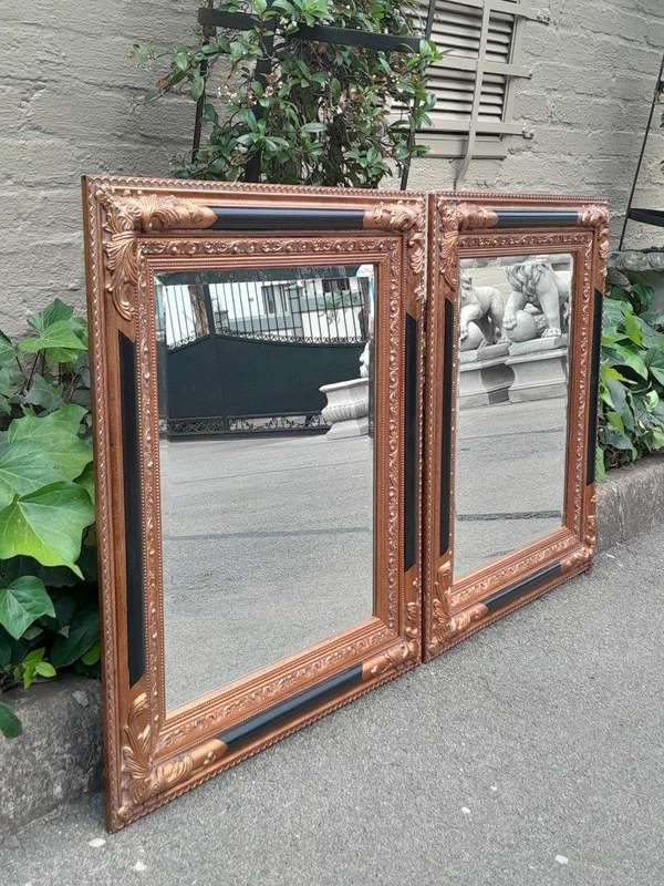 A 20th Century Pair Of French Empire-Style  Ebonised And Gilt-Painted Mirrors