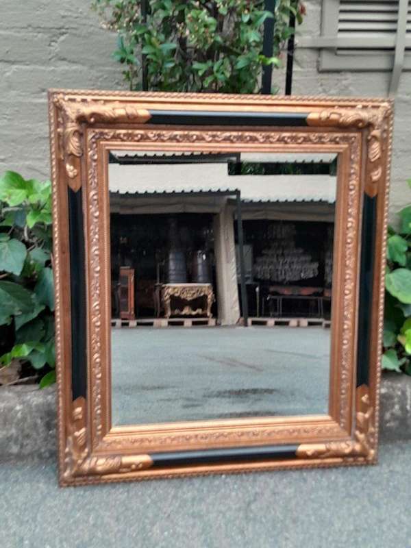 A 20th Century Pair Of French Empire-Style  Ebonised And Gilt-Painted Mirrors