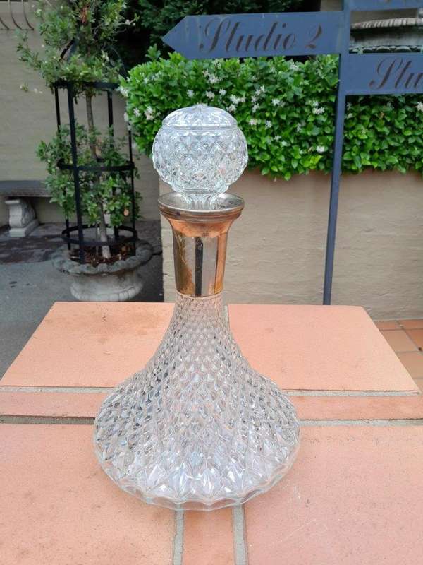 A Hand Blown Crystal Decanter With Stopper