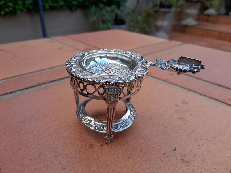 A 20TH Century Dutch Hallmark Silver Tea Strainer On Stand