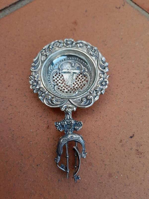 A 20TH Century Dutch Hallmark Silver Tea Strainer On Stand
