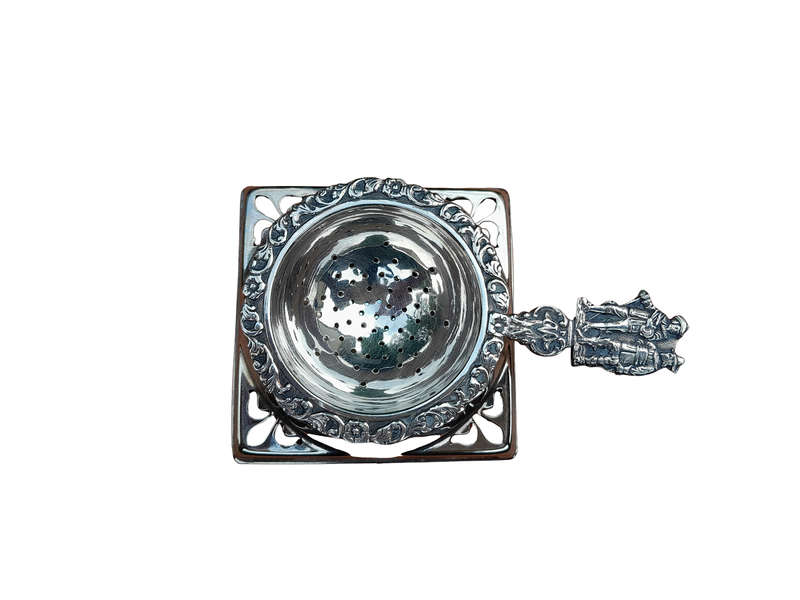 A Silver Plated Tea Strainer English