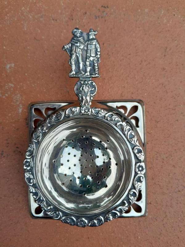 A Silver Plated Tea Strainer English