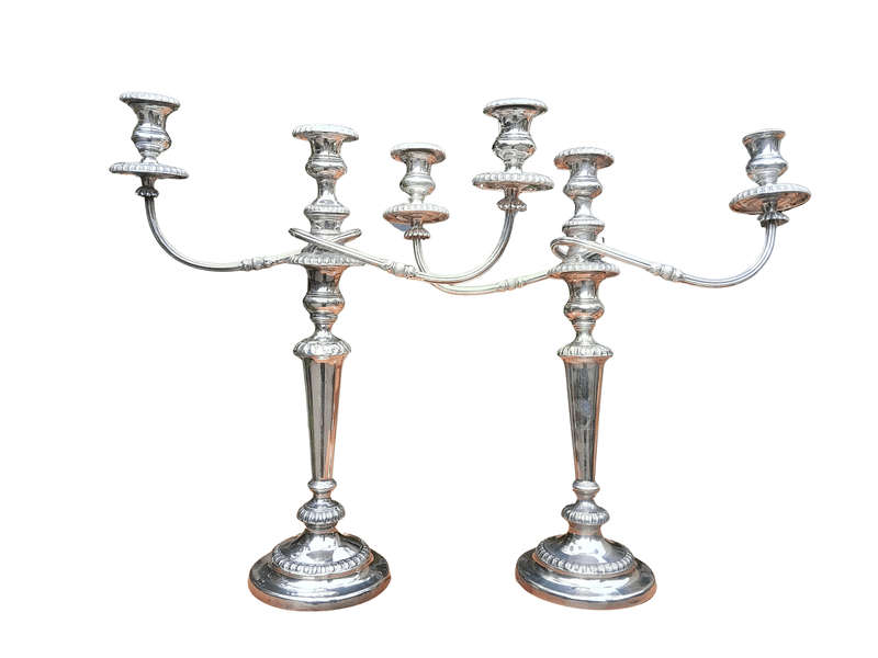 A 20TH Century Pair of Silver Plated Embossed Candelabra