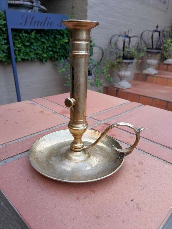 An Antique Hand Portable Brass Candle Holder With Great Vintage Patina