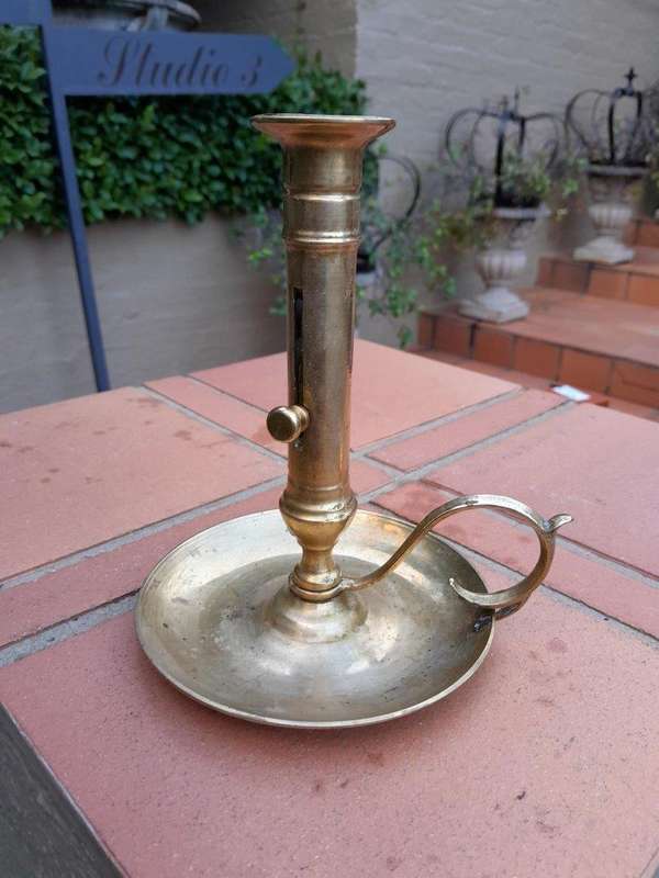 An Antique Hand Portable Brass Candle Holder With Great Vintage Patina