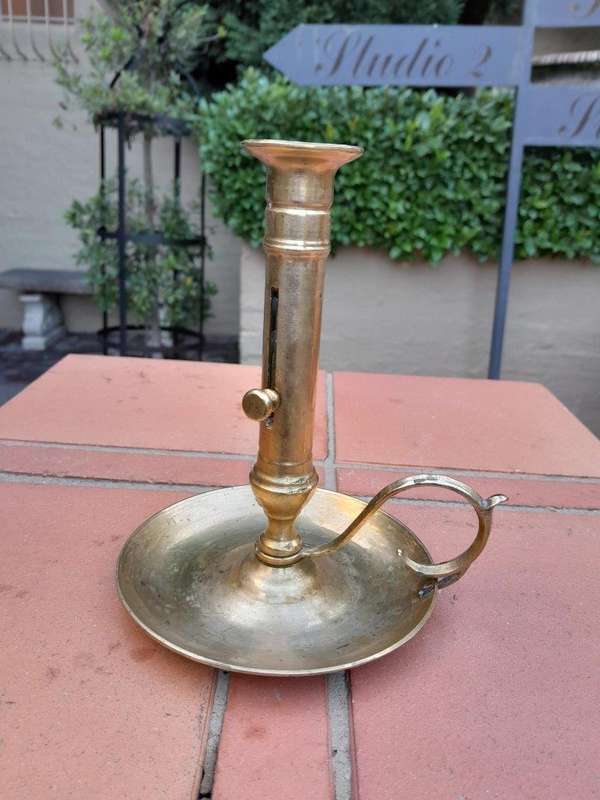 An Antique Hand Portable Brass Candle Holder With Great Vintage Patina