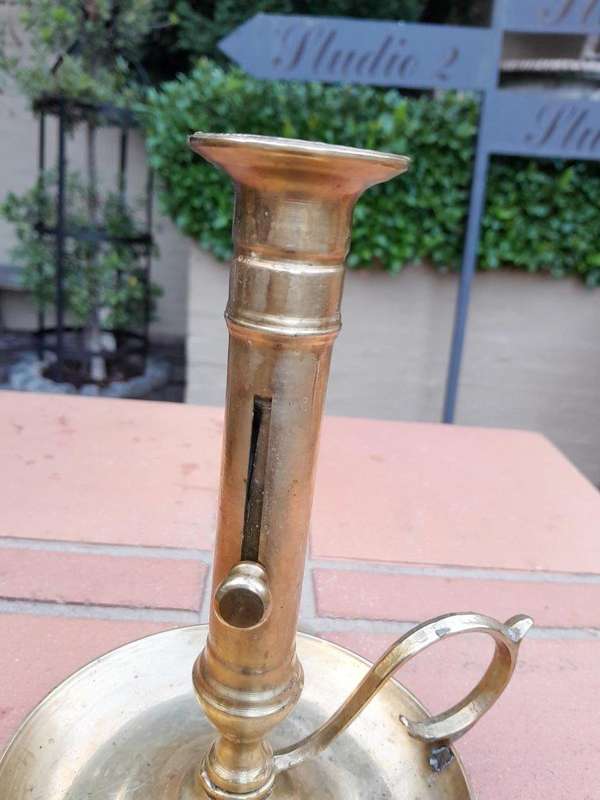 An Antique Hand Portable Brass Candle Holder With Great Vintage Patina