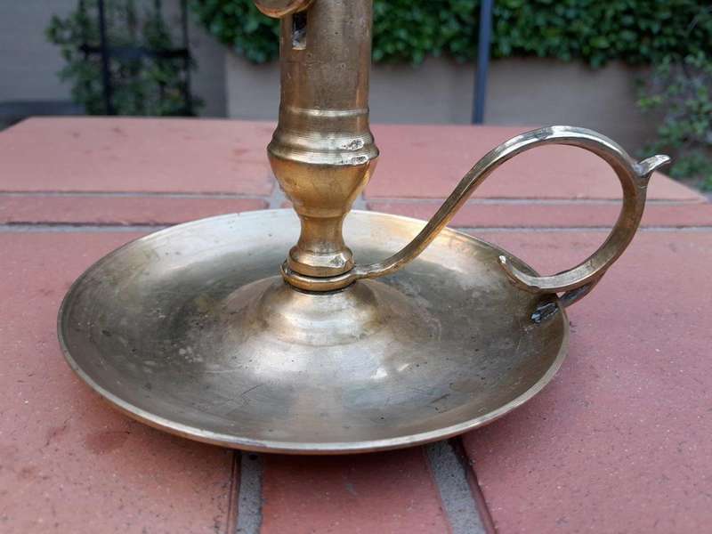 An Antique Hand Portable Brass Candle Holder With Great Vintage Patina