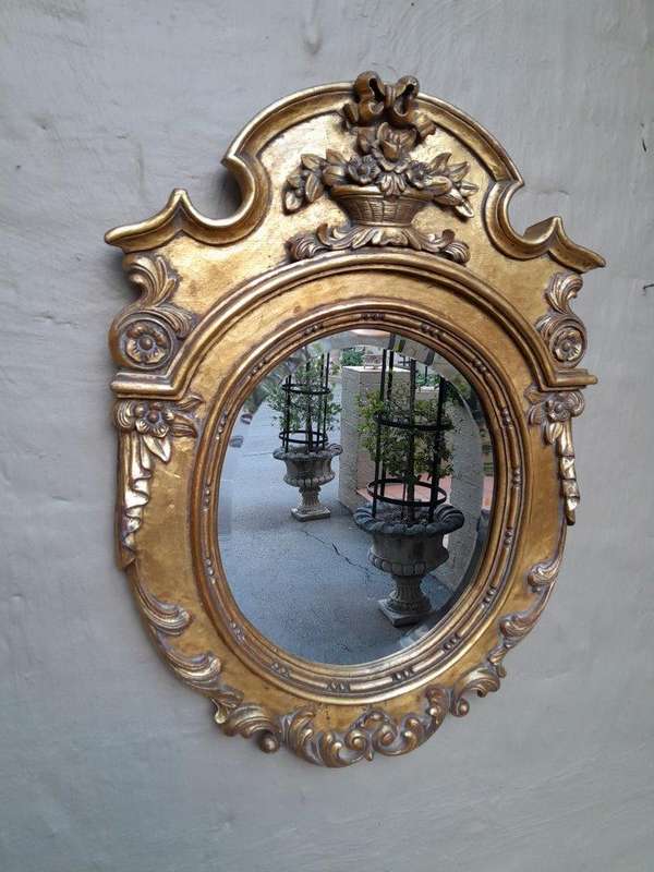 A 20th Century Carved and Gilded Bevelled Oval Mirror