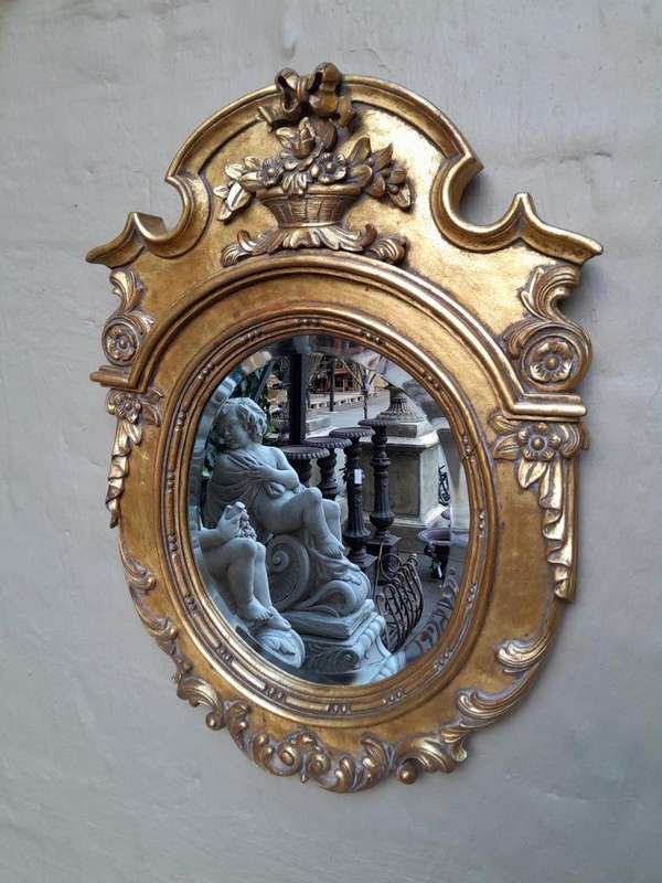 A 20th Century Carved and Gilded Bevelled Oval Mirror