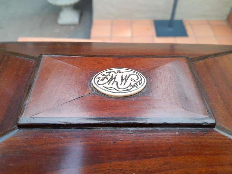 An antique 19th Century Mahogany Tea Caddy with Brass Lions Head Handles