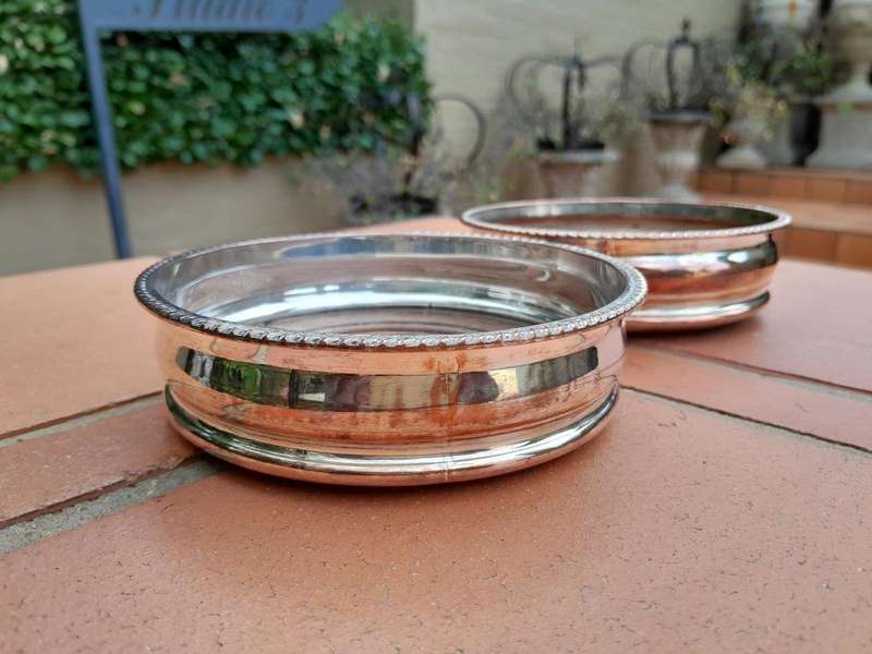 A 20th Century Pair of Silver- plate Wine Coasters with Wooden Bases