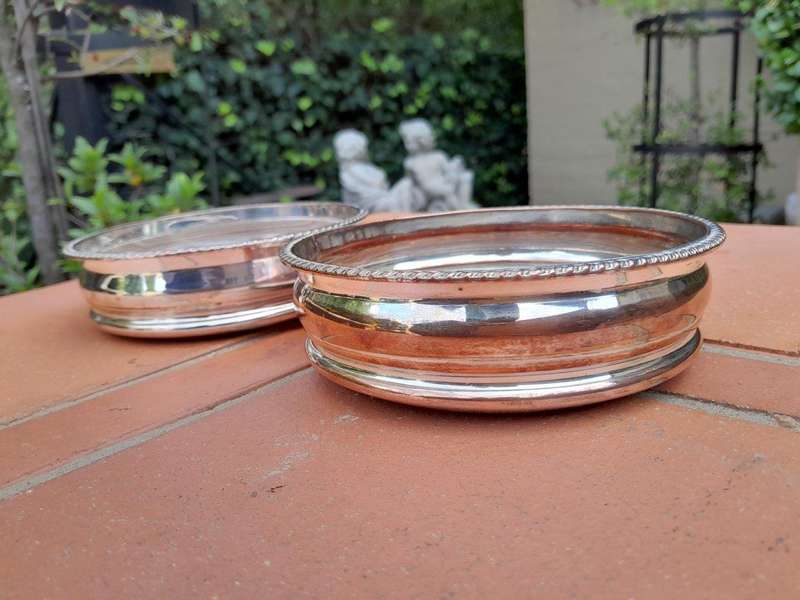 A 20th Century Pair of Silver- plate Wine Coasters with Wooden Bases