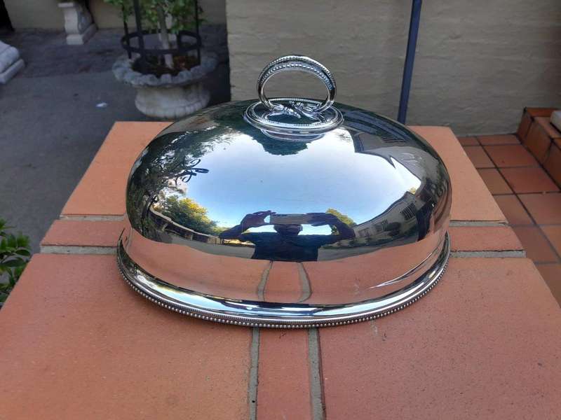 An Electroplate Food Dome Dimensions: 31cm wide R3800