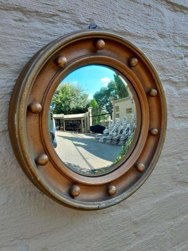 An early 20th Century Circa 1920 Regency Style Giltwood Mirror with Convex Frame
