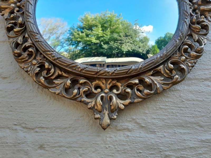An Early 20th Century Circa 1920 Ornately Carved Giltwood Convex Mirror