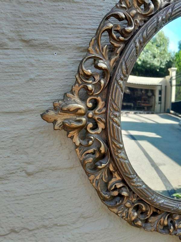 An Early 20th Century Circa 1920 Ornately Carved Giltwood Convex Mirror