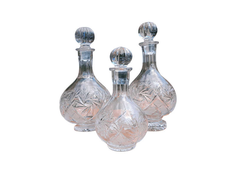 A Set of  Three Neman Cut Crystal Decanters