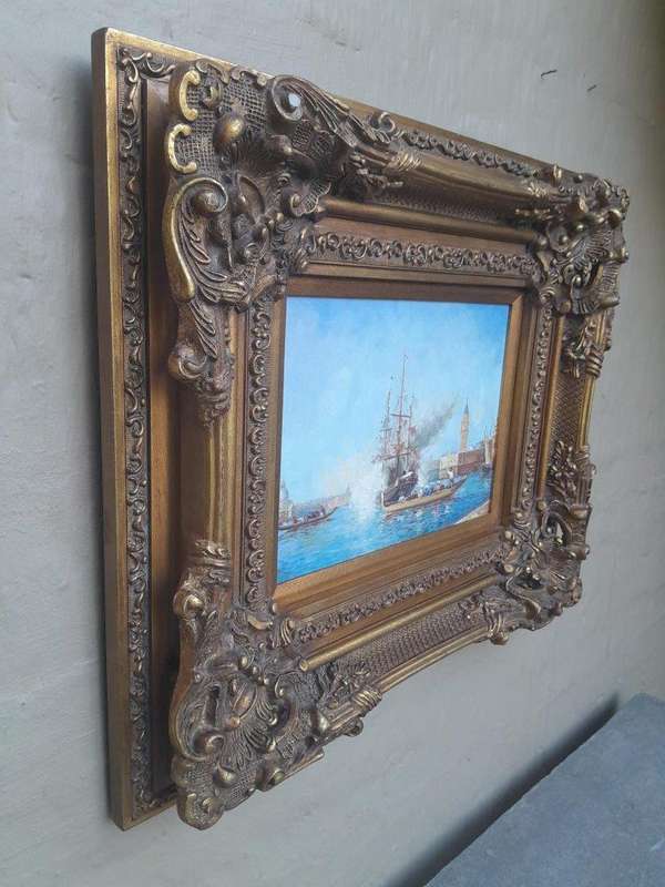 A 20th Century Continental School Oil on Canvas Ship Painting in a Ornately Carved and Gilded Frame