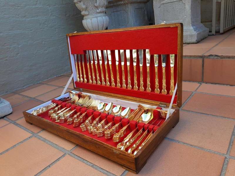 A Canteen Of 24kt 12 Place Ornately Gold Plated Stainless Steel Cutlery Set