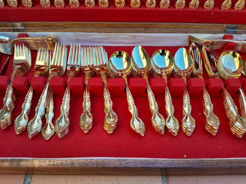A Canteen Of 24kt 12 Place Ornately Gold Plated Stainless Steel Cutlery Set