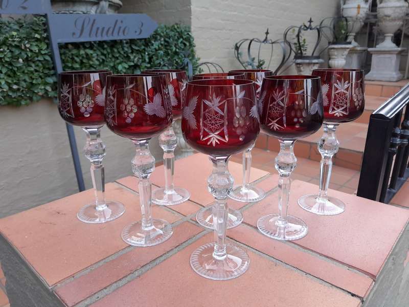 A 20th Century Set Of Eight Burgundy Bohemian Cut Crystal Wine Glasses