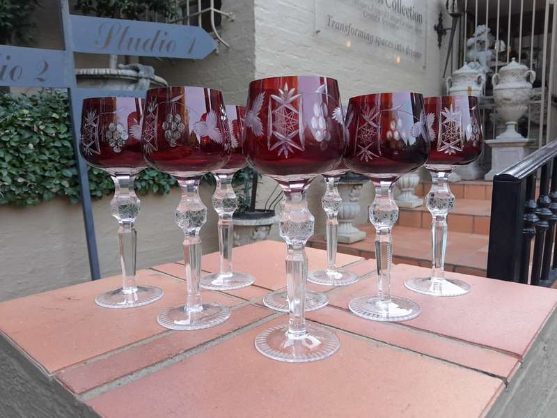 A 20th Century Set Of Eight Burgundy Bohemian Cut Crystal Wine Glasses