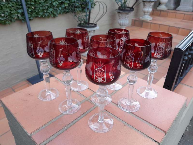 A 20th Century Set Of Eight Burgundy Bohemian Cut Crystal Wine Glasses
