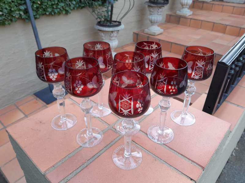 A 20th Century Set Of Eight Burgundy Bohemian Cut Crystal Wine Glasses
