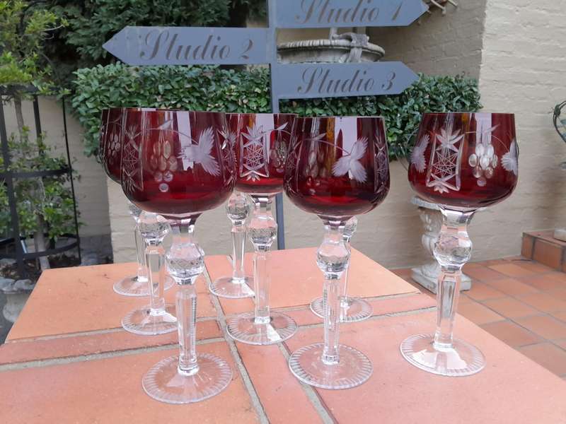 A 20th Century Set Of Eight Burgundy Bohemian Cut Crystal Wine Glasses