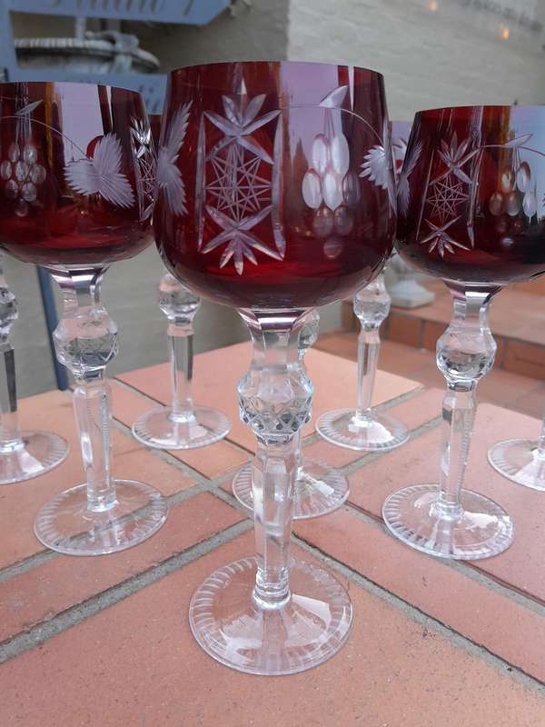 A 20th Century Set Of Eight Burgundy Bohemian Cut Crystal Wine Glasses