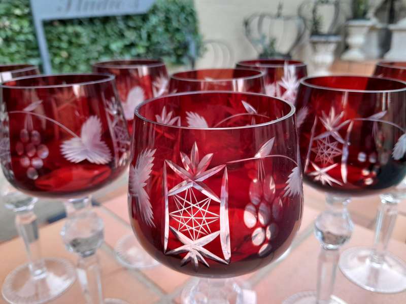 A 20th Century Set Of Eight Burgundy Bohemian Cut Crystal Wine Glasses