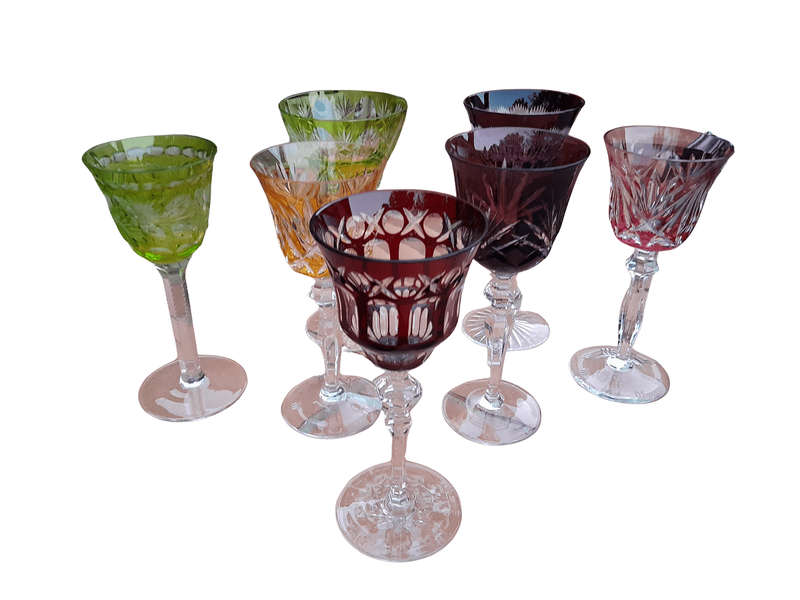 A 20th Century Collection Of Seven Coloured Bohemian Cut Crystal Wine Glasses