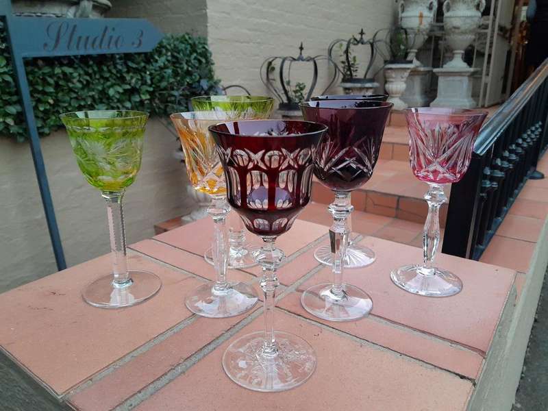 A 20th Century Collection Of Seven Coloured Bohemian Cut Crystal Wine Glasses