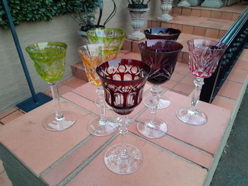 A 20th Century Collection Of Seven Coloured Bohemian Cut Crystal Wine Glasses