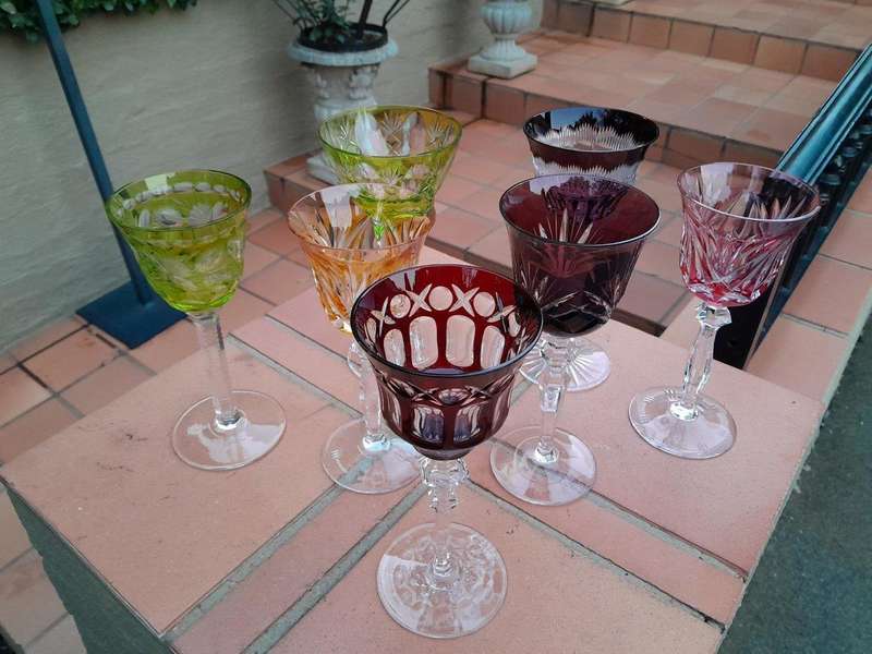 A 20th Century Collection Of Seven Coloured Bohemian Cut Crystal Wine Glasses