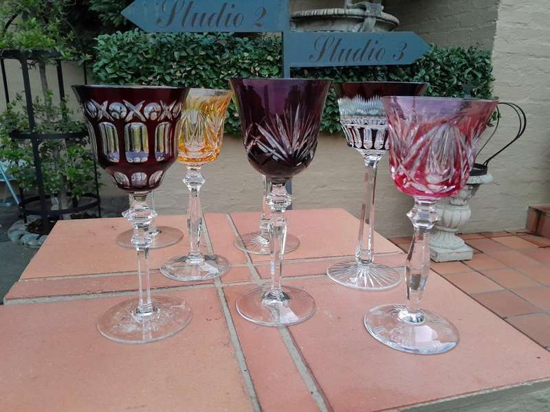 A 20th Century Collection Of Seven Coloured Bohemian Cut Crystal Wine Glasses