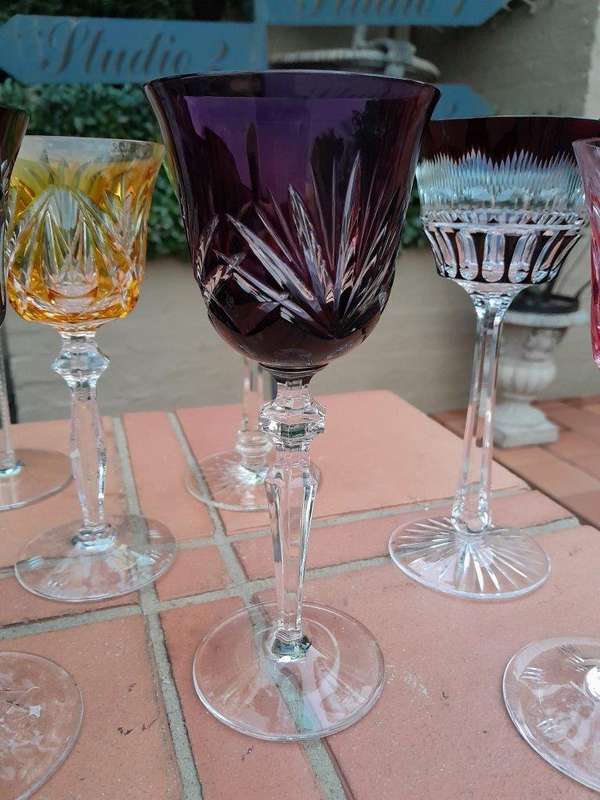 A 20th Century Collection Of Seven Coloured Bohemian Cut Crystal Wine Glasses